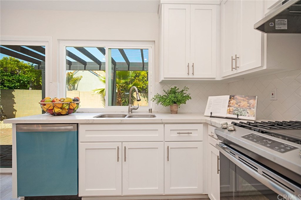 1745 North Bates Circle Anaheim, CA 92806 - Photo 11 of 32 Quartz counters, custom shaker cabinetry, and stainless steel appliances