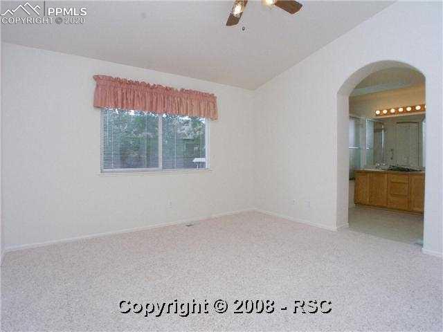 6635 Quarter Circle Road Colorado Springs, CO 80922 - Photo 6 of 10 Master Bedroom With 4-Piece Bath, Walk In Closet & Sky Light