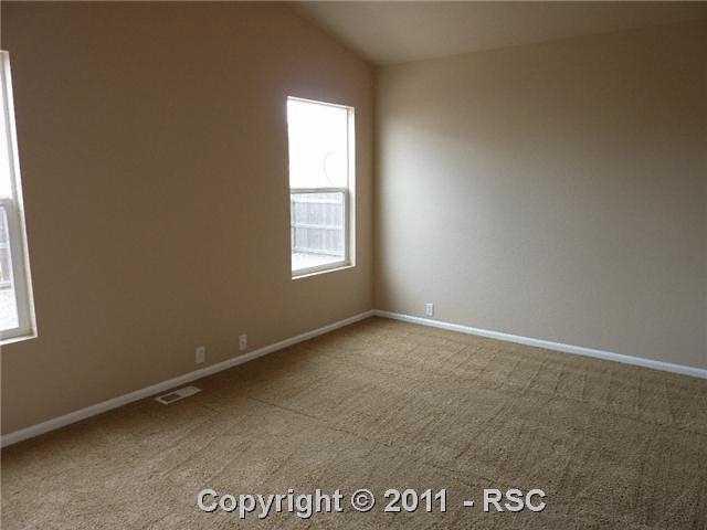 12337 Crystal Downs Road Peyton, CO 80831 - Photo 8 of 13 Fresh interior paint in home included in the master bedroom