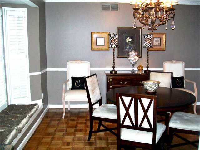 2100 Brierbrook Road Germantown, TN 38138 - Photo 4 of 12 Lovely Dining Room features Bay Window with Plantation Shutters and wonderful window seat, gleaming floors and pretty millwork. Perfect for holiday entertaining!