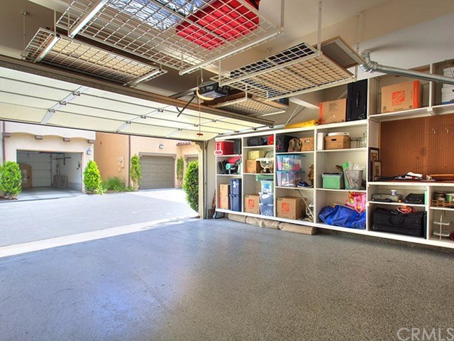 124 White Flower Irvine, CA 92603 - Photo 16 of 26 Large 2 car attached finished garage with shelves. and overhead storage and an epoxy floor!