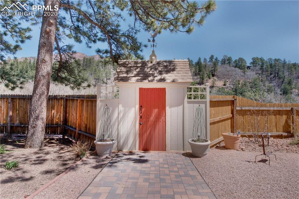 7955 Highway 24 Cascade, CO 80809 - Photo 2 of 36 Mini gatehouse with copper weather vane greets visitors as they enter the driveway.