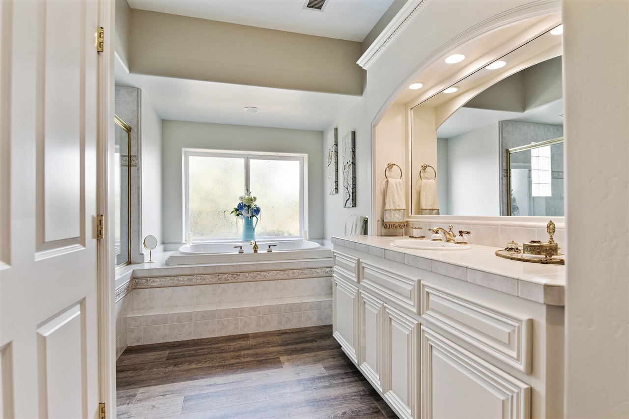 2206 Dos Lomas Fallbrook, CA 92028 - Photo 12 of 25 The Master Bath is freshly painted and with new waterproof flooring. Features dual vanities, dual walk-in closets, soaker tub and oversized stand-up shower