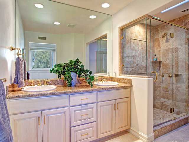 17036 Circa Del Sur Rancho Santa Fe, CA 92067 - Photo 14 of 25 All 3 upstairs en-suite baths have been beautifully updated with stone finishes. This bath has double sinks which can help create an upstairs master or even a shared children's bedroom.
