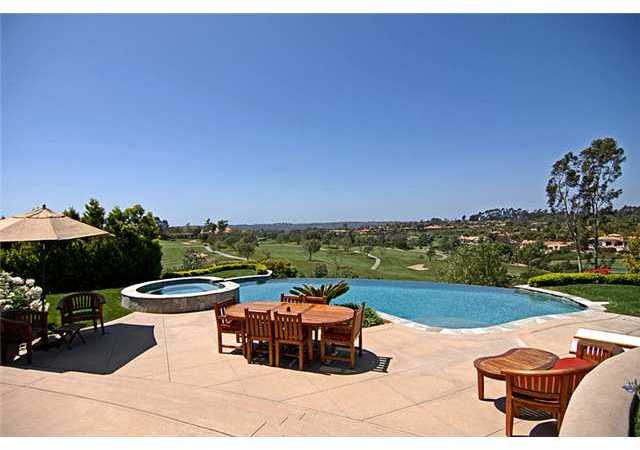 6890 St Andrews Road Rancho Santa Fe, CA 92067 - Photo 13 of 15 Patio and vanishing edge pool overlooking the golf course and surrounding Rancho Santa Fe.