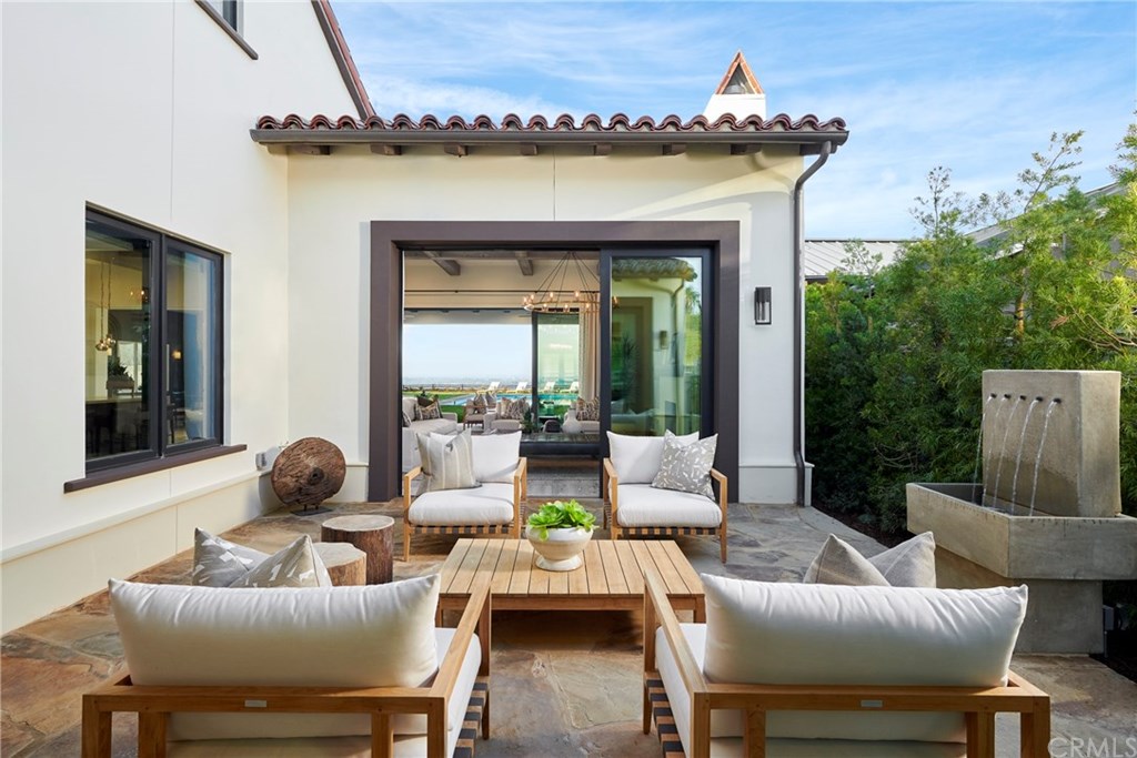 18 Phillips Ranch Road Rolling Hills Estates, CA 90274 - Photo 6 of 12 The entry courtyard with the open stacked sliders allowing easy & luxurious flow-through entertaining in this home.