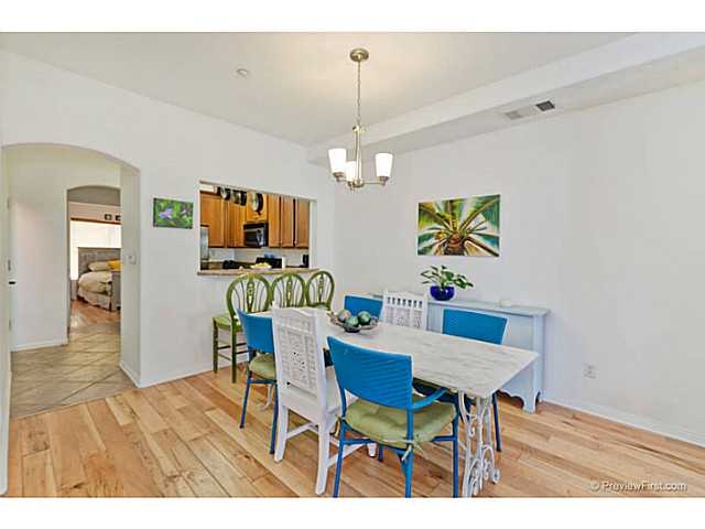 366 Forward Street, Unit E La Jolla, CA 92037 - Photo 4 of 23 Dining Area with Hardwood Floors and pass through bar to kitchen
