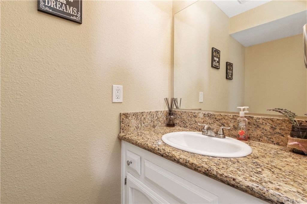 628 4th Street Paso Robles, CA 93446 - Photo 11 of 22 Downstairs powder room with granite counter vanity