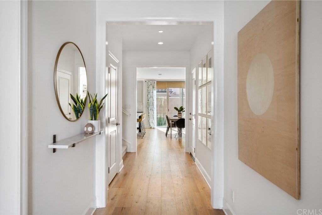 116 Mosswood Irvine, CA 92620 - Photo 3 of 42 The bright entry hall showcases the beautiful Siberian Oak flooring.