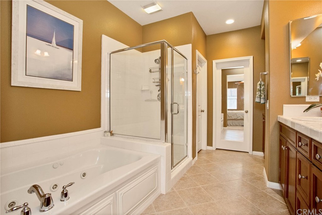 21 Corte Javier San Clemente, CA 92673 - Photo 17 of 30 The master bathroom is fresh and bright with jetted bath tub and tiled walk-in shower.