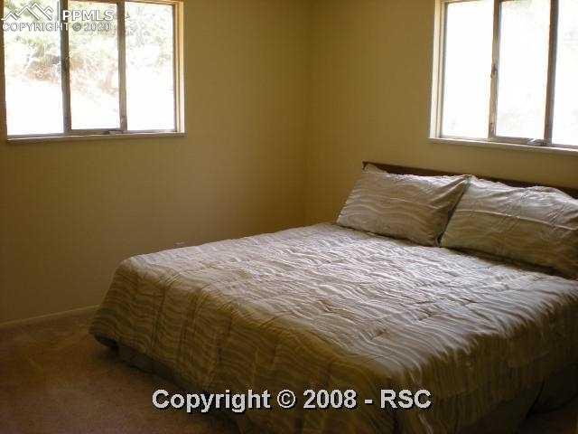 7930 Topeka Avenue Cascade, CO 80809 - Photo 5 of 10 Light & bright master bedroom on main level