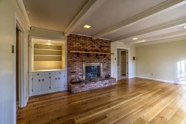 4329 Burgundy Road Memphis, TN 38111 - Photo 7 of 25 Den with original plank floors, masonry fireplace, exposed ceiling beams, built-ins. Fireplace tools stay. Large windows overlooking back patio.