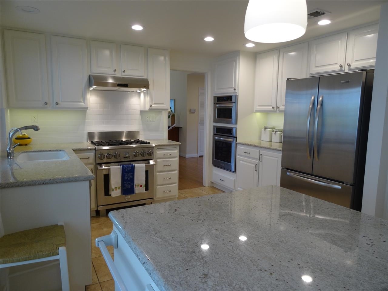 13312 Pantera Road San Diego, CA 92130 - Photo 4 of 25 Upgraded kitchen with stainless steel appliances, granite counter tops & island.