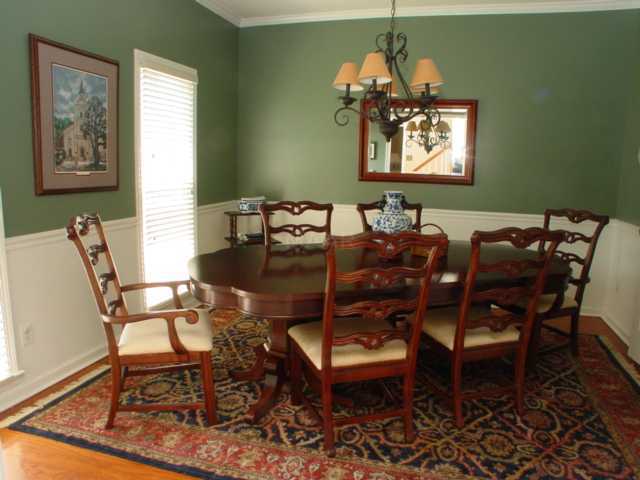 8516 Dulwich Road Memphis, TN 38016 - Photo 5 of 20 Formal dining room just off the entry and kitchen. It has a chair rail and two windows. Notice new floors, hi ceilings.