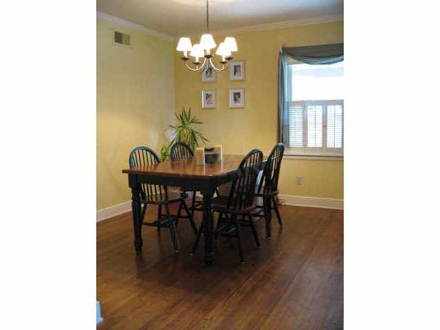 324 Fernway Road Memphis, TN 38117 - Photo 4 of 10 Separate dining room has two windows and a shelved storage closet. The hardwood floors are gleaming!