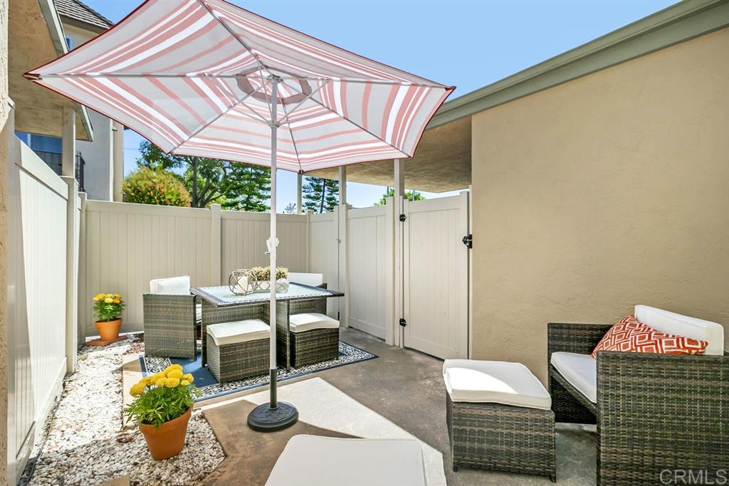 7855 Hummingbird Lane San Diego, CA 92123 - Photo 15 of 25 Enjoy San Diego's beautiful weather all year from one of two patio. The back patio is accessible from the living room and the carport area.