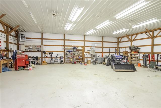 6024 Earhart Road Springfield, TN 37172 - Photo 26 of 30 The Hangar is 50'x50'x15" constructed from wood then later covered with Baked "red" aluminum siding. The doors are on rollers and slide to each side. It is heated and cooled. Has 110 & 220 wiring.