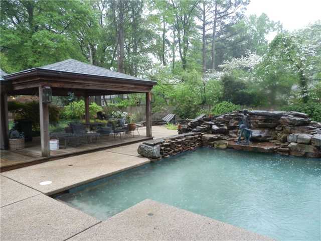 5345 Lexington Road Memphis, TN 38120 - Photo 6 of 23 How about the very special and gorgeous pool as one of the surprises! It is Gunnite, handsomely decorated with interesting stone work. A rushing water fall, a thrilling water slide & a natural rock diving board offer special pool adventures.