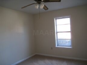 6415 Bardstown Road Bartlett, TN 38134 - Photo 11 of 12 This is the second bedroom. Notice the new paint and carpet!