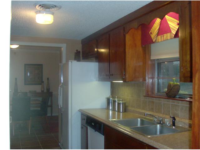 3434 Clarke Road Memphis, TN 38115 - Photo 9 of 12 Kitchen with new granite counter tops and tile backsplash.