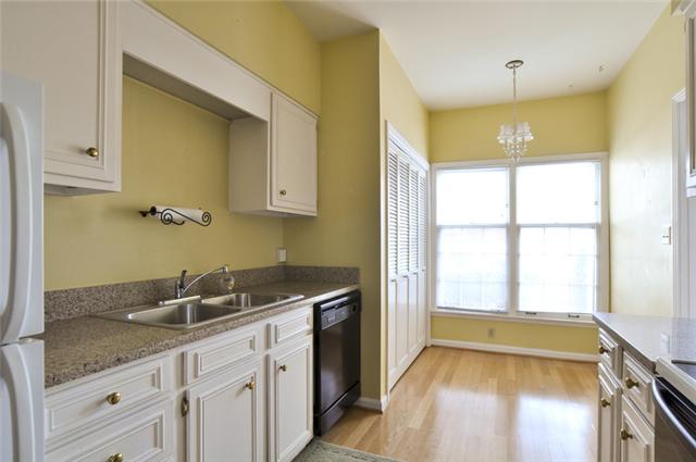 4505 Harding Pike, Unit 106 Nashville, TN 37205 - Photo 7 of 13 Behind the bi-fold doors in the eating area is the washer and dryer.