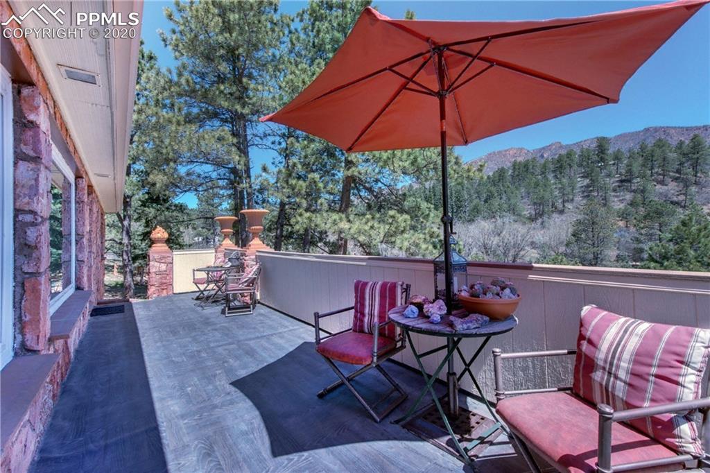 7955 Highway 24 Cascade, CO 80809 - Photo 35 of 36 Composite deck off the front of the home