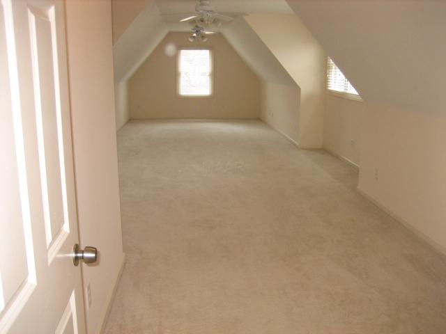 984 Summer Spring Road Collierville, TN 38017 - Photo 10 of 12 Huge bonus room off media room has permanent stairs to huge attic area with lots of storage space.