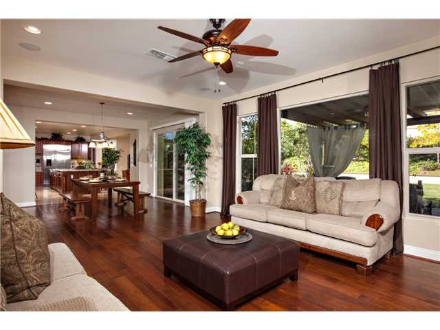 6989 Corte Langosta Carlsbad, CA 92009 - Photo 9 of 25 View from the "gathering room" towards the breakfast / sitting area. Gathering room has a 2 sided fireplace that is shared with a covered loggia.