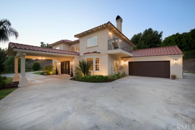 1619 Benik Road La Habra Heights, CA 90631 - Photo 1 of 1 As the sun starts to set, this estate shines against a backdrop of greenery. The balcony off the master bedroom is the perfect place for a morning cappuccino or to wind down and enjoy the night air.
