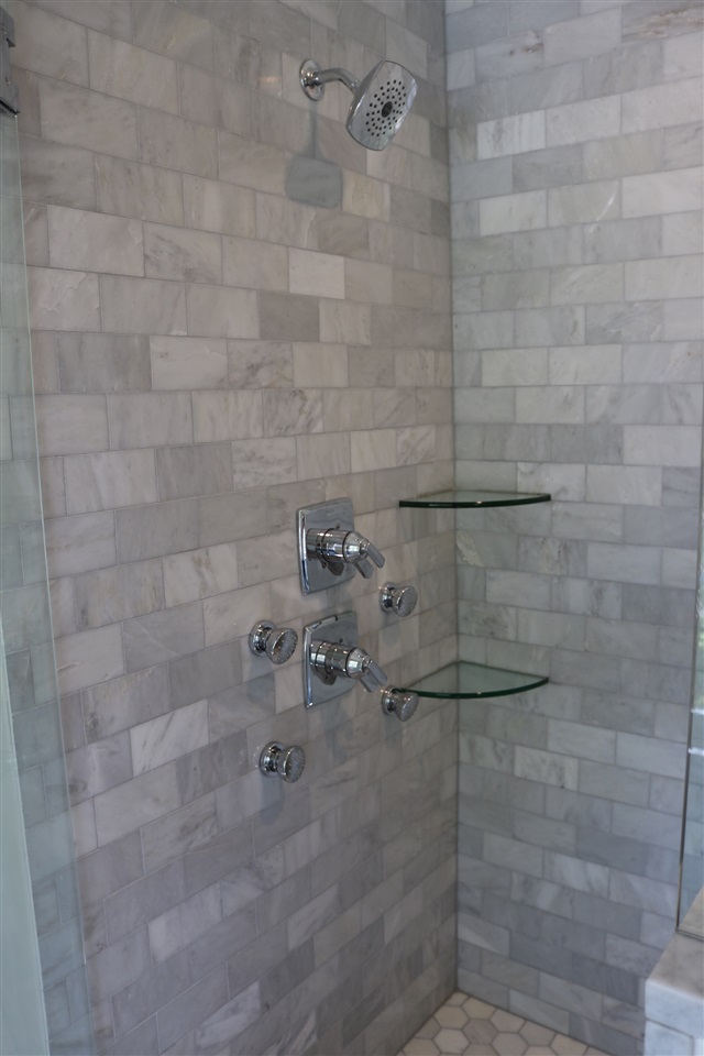 194 Lombardy Road Memphis, TN 38111 - Photo 11 of 25 Walk in master shower has frameles glass shower door, all carrara marble, 4 additional body sprays and built in bench