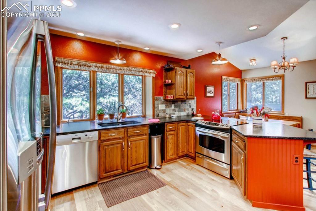 3210 Arena Road Colorado Springs, CO 80921 - Photo 10 of 30 Kitchen with lots of windows and dinette nook.