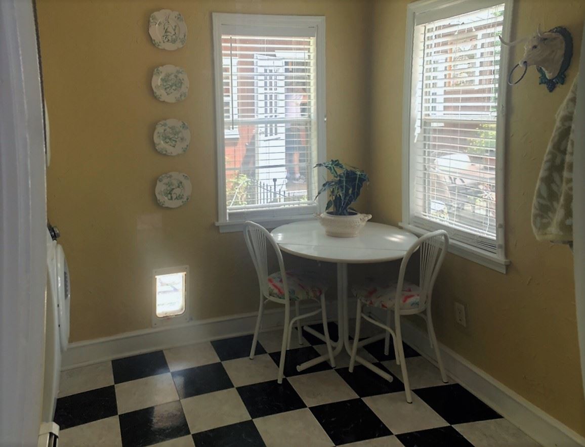 Laundry features two windows that bring in plenty of natural light and a back door to allow this room to double as a mud room.