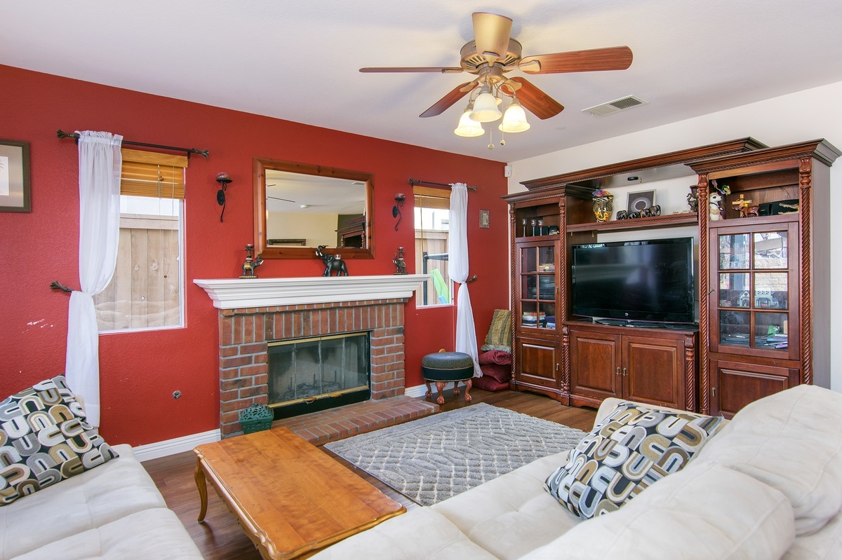 369 Spring Canyon Way Oceanside, CA 92057 - Photo 9 of 25 Traditional brick fireplace with custom mantel. Bamboo wood floors.