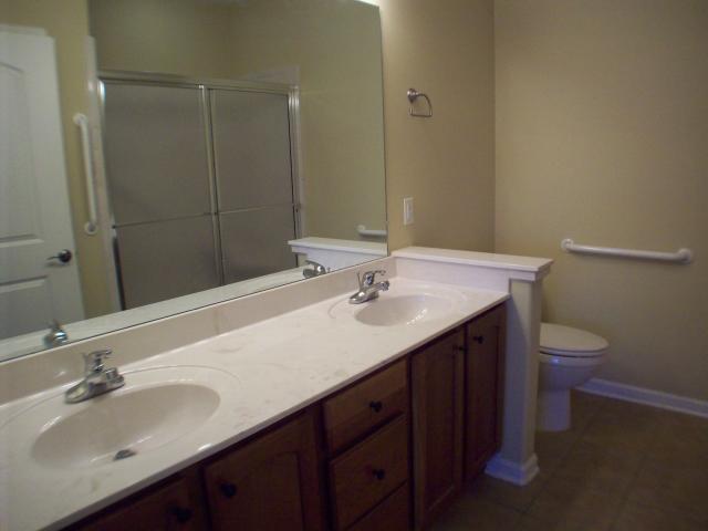26 Peyton Ridge Drive, Unit 22 Collierville, TN 38017 - Photo 7 of 12 Master Bath with double sinks, walk-in shower, tile floor and linen closet.