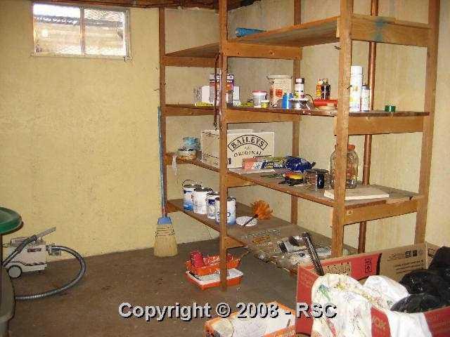 1908 North Chelton Road Colorado Springs, CO 80909 - Photo 12 of 16 Lots of room for your "stuff" in this basement storage area