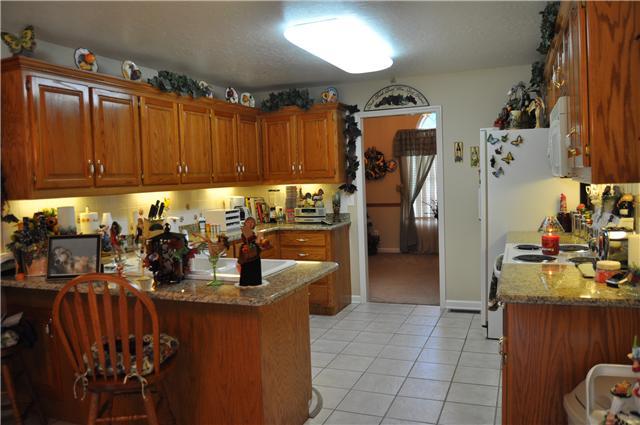 806 Pickney Road Winchester, TN 37398 - Photo 13 of 24 Kithen has nice tile floors and granite counter tops.