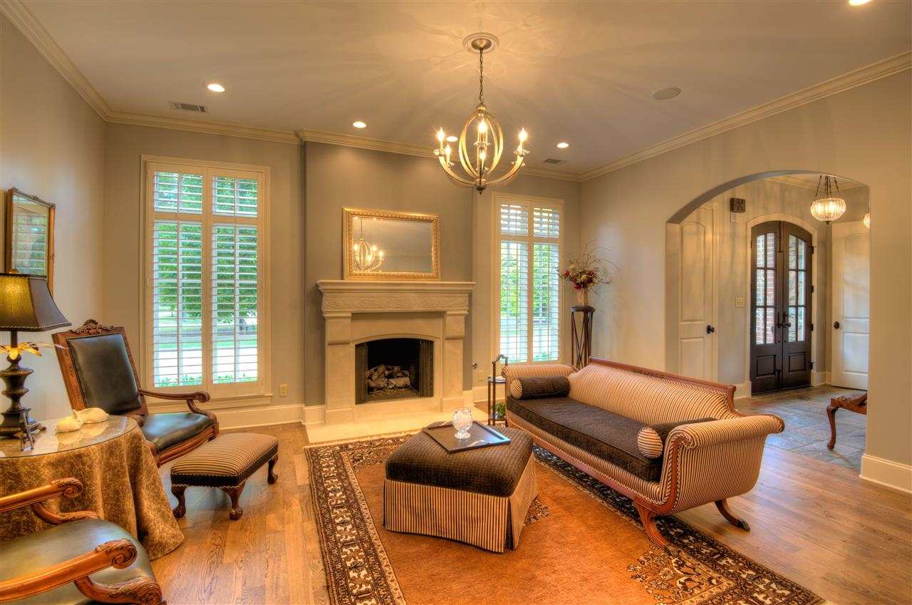 1277 South Dubray Place Collierville, TN 38017 - Photo 3 of 25 Open concept 18 x15 Living Room features limestone mantel, hardwood floors, plantation shutters and ten foot smooth ceiling