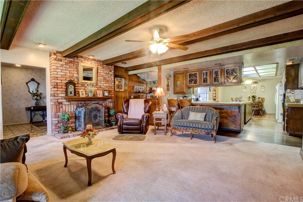 8558 11th Street Downey, CA 90241 - Photo 3 of 26 living room fireplace with entry on the left.