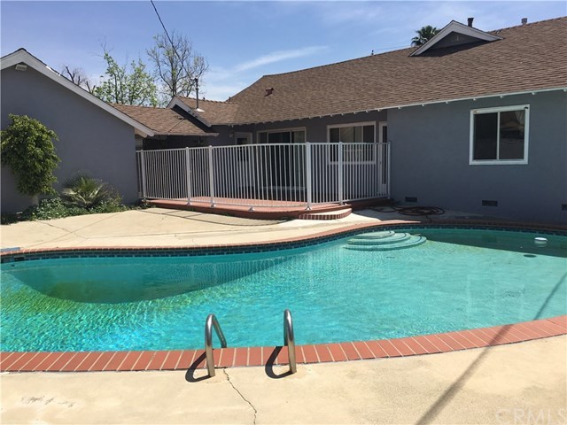 565 East Benbow Street Covina, CA 91722 - Photo 9 of 12 Patio area off bedroom, kitchen and dining room. Shows gated rod iron fence to pool area.