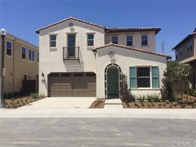 38 Molly Loop Ladera Ranch, CA 92694 - Photo 1 of 1 Exterior of Home with Driveway / Santa Barbara Exterior with tiled archway detail & step out wrought iron Juliette Balcony !