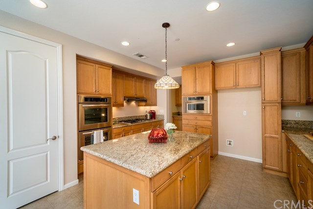5473 Stoneview Road Rancho Cucamonga, CA 91739 - Photo 14 of 56 Open kitchen with storage closet and walk in pantry