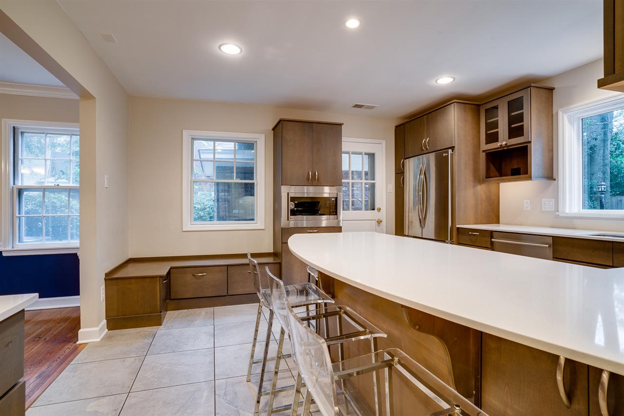 4451 Fair Meadow Road Memphis, TN 38117 - Photo 10 of 24 Breakfast bar & built-in seating with additional storage with room for a small kitchen table.