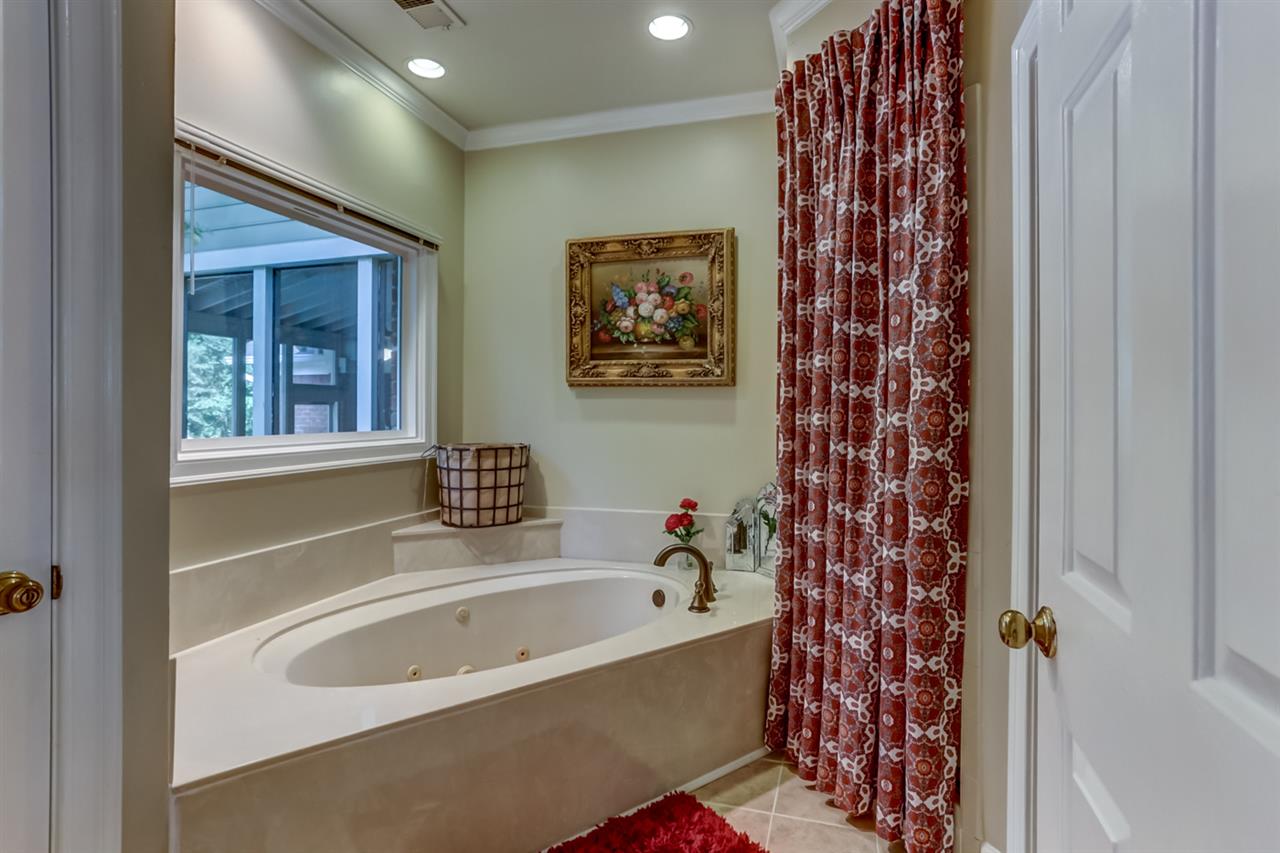 28 Summer Grove Road South Memphis, TN 38018 - Photo 16 of 25 Also featuring over-sized corner whirlpool tub, large 5' separate shower with tile walls and ceiling, privacy toilet room and linen closet.