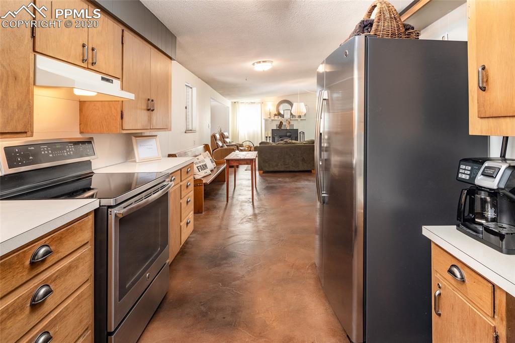 8715 Chipita Park Road Cascade, CO 80809 - Photo 20 of 33 Looking back from the kitchen into the great room.