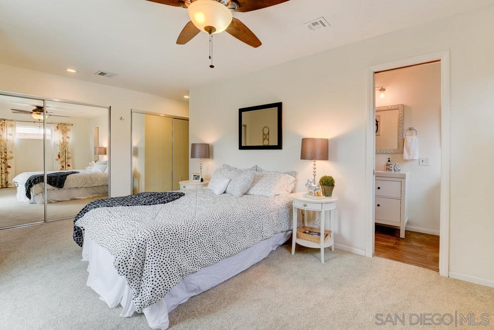 14215 Powers Road Poway, CA 92064 - Photo 15 of 25 Enlarged master bedroom with two large closets, French slider to backyard and en suite bathroom.