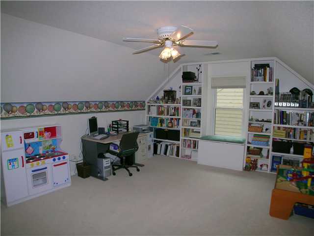 1896 Edwards Mill Road Germantown, TN 38139 - Photo 12 of 12 Bedroom 4 or bonus room, new carpet, ceiling fan, built-in bookshelves and window seat.
