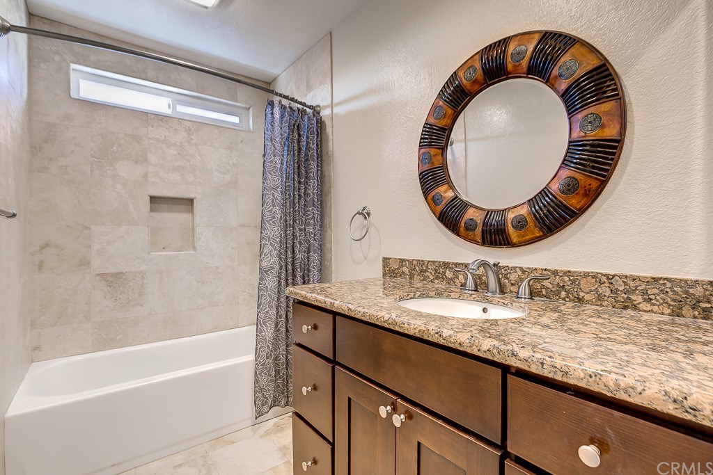 1000 Shadow Canyon Road Brea, CA 92821 - Photo 25 of 32 Hall bath has shaker cabinets and granite counters.