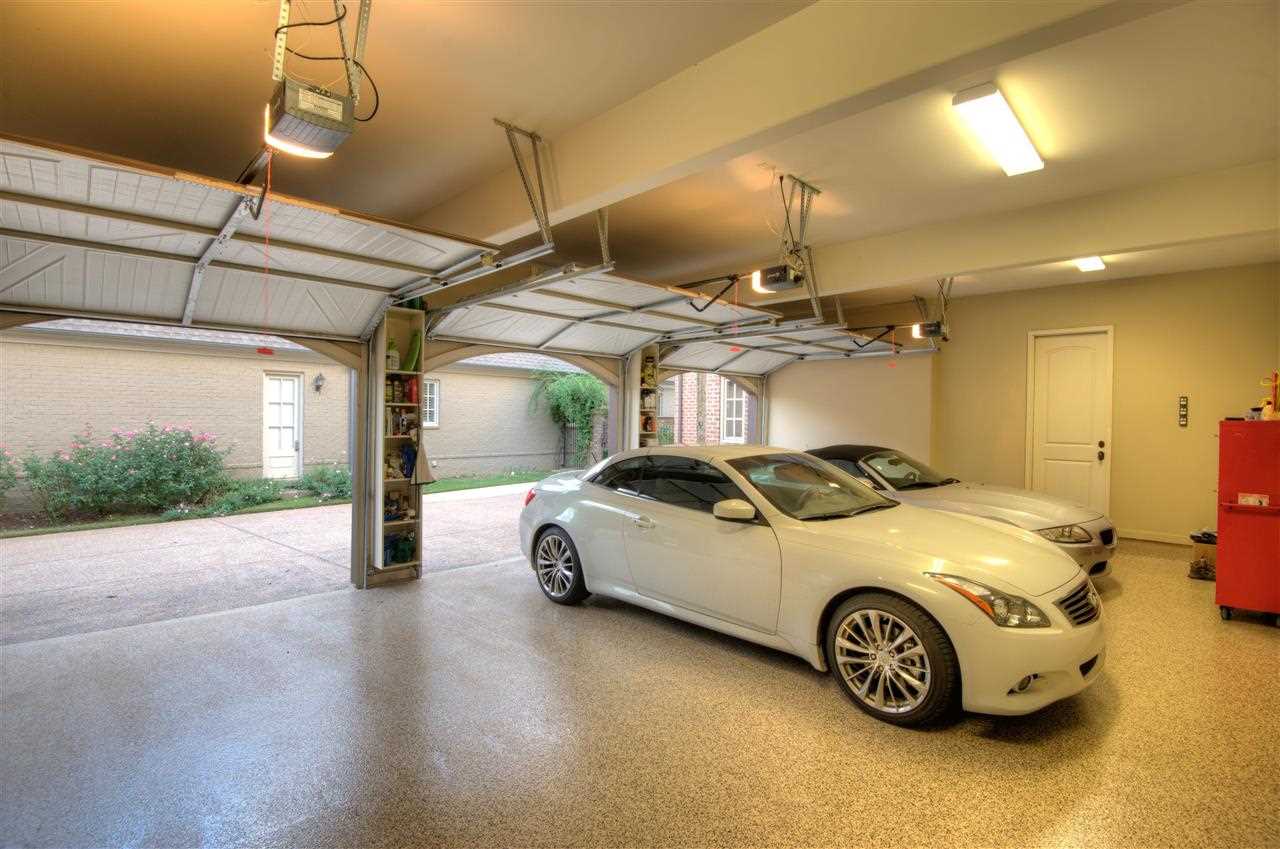 1277 South Dubray Place Collierville, TN 38017 - Photo 22 of 25 Three car garage with Carriage doors and oversized drive. The Epoxy floor has a flawless finish for low maintenance.