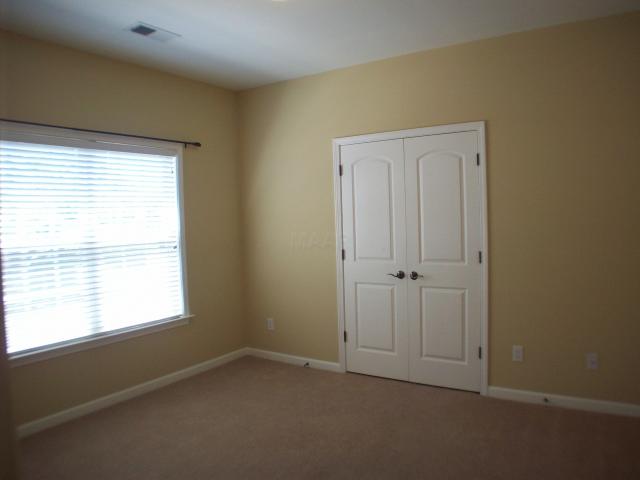26 Peyton Ridge Drive, Unit 22 Collierville, TN 38017 - Photo 9 of 12 Bedroom # 3 with carpet, faux wood blinds, and smooth ceilings.