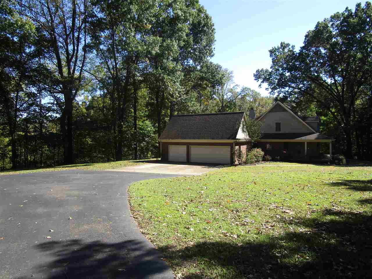 8180 Hines Road Millington, TN 38053 - Photo 22 of 22 Super maintained wide asphalt drive and lots of additional parking as well as 3 car garage view.